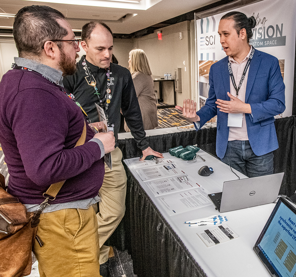 ACUI members talk to a corporate partner during the ACUI Expo